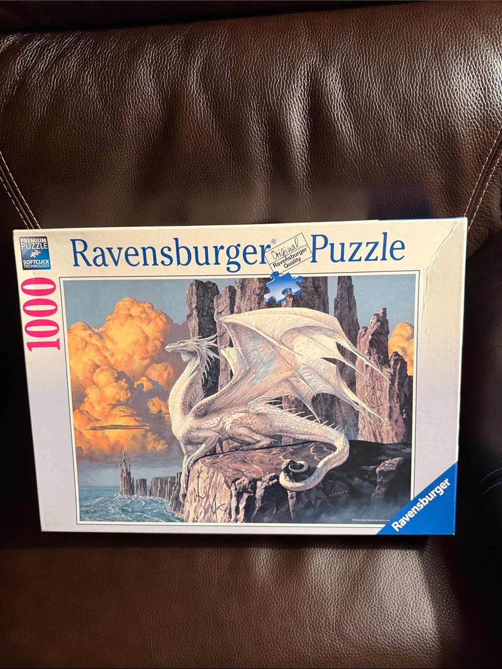 Ravensburger White Dragon Puzzle Box with Orange Clouds and Blue Ocean 1000 pc